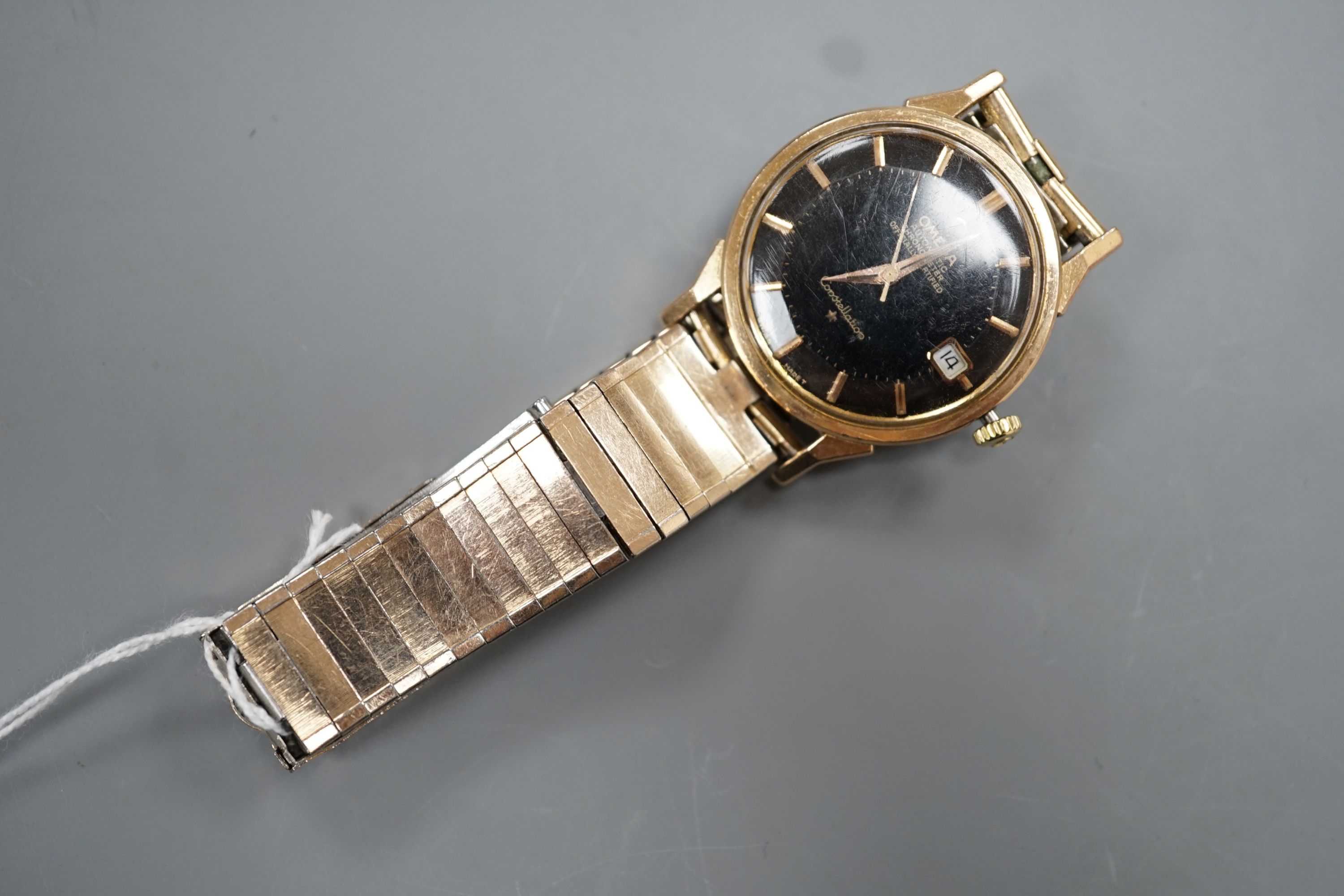 A gentleman's steel and gold plated Omega Automatic Constellation black dial wrist watch, on associated bracelet, case diameter 34mm (winding crown a.f.).